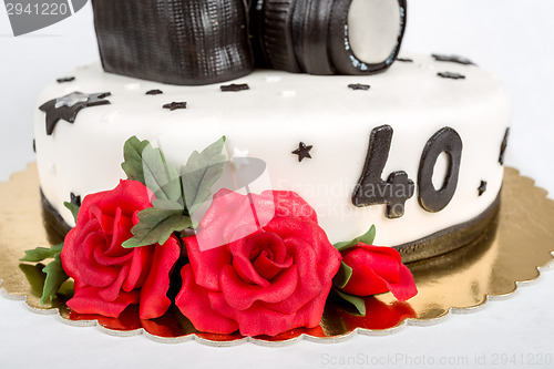 Image of birthday cake for forty anniversary with modern DSLR photo camera