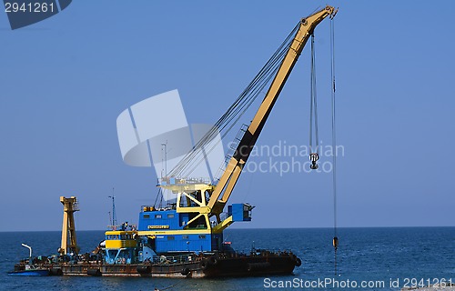Image of The floating crane on the seashore