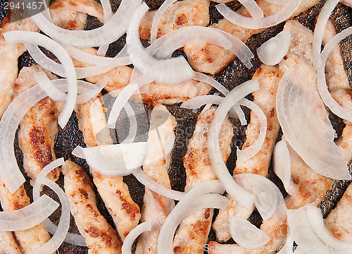 Image of Meat Strips Fried With Onion In A Pan