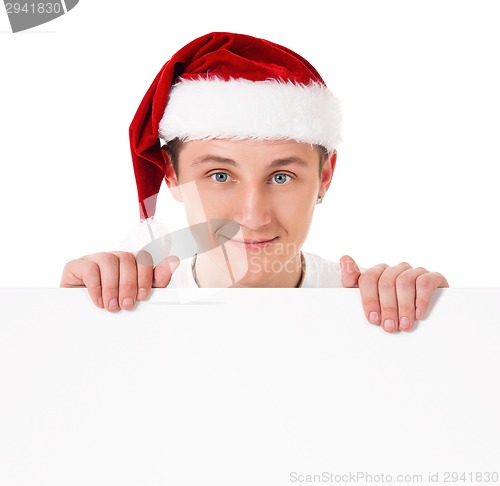 Image of Young man in Santa hat