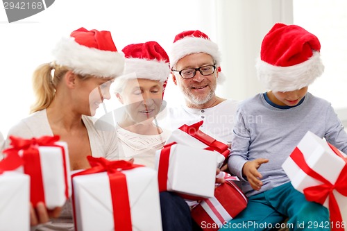 Image of happy family sitting on couch at home