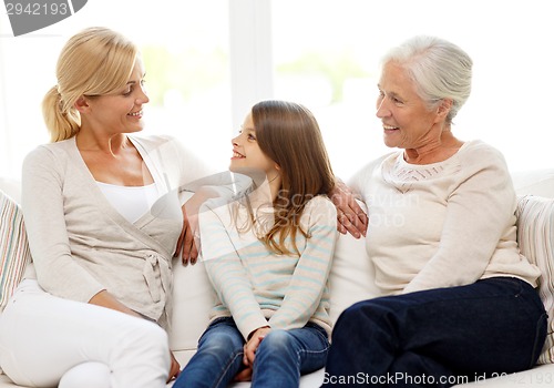 Image of smiling family at home