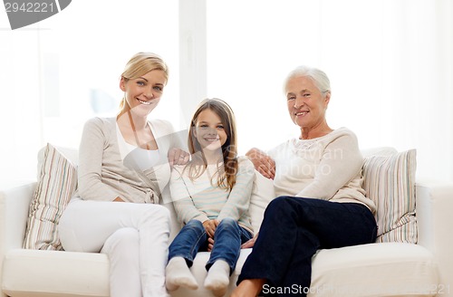 Image of smiling family at home