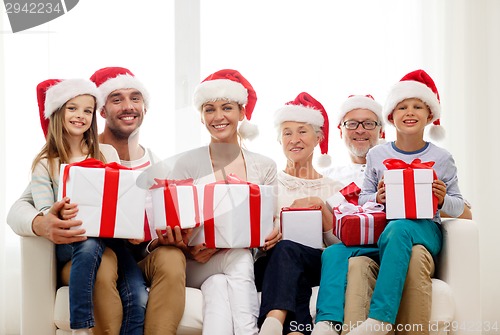 Image of happy family sitting on couch at home