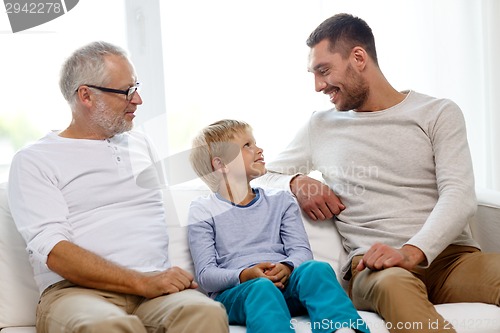 Image of smiling family at home