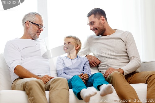 Image of smiling family at home