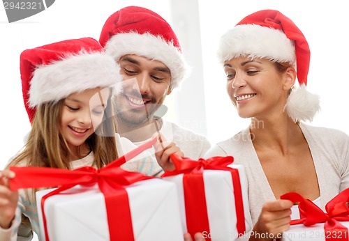 Image of happy family sitting on couch at home