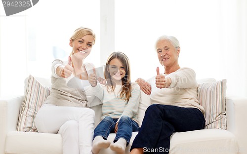 Image of smiling family at home