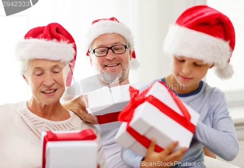 Image of happy family sitting on couch at home