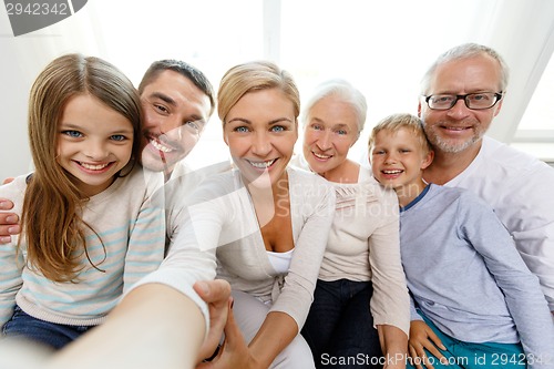 Image of happy family making selfie at home