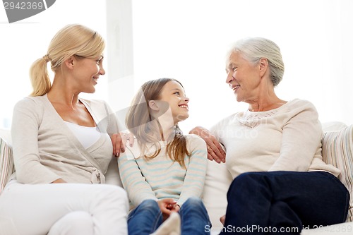 Image of smiling family at home