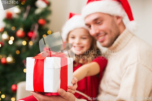 Image of close up of father and daughter with gift box