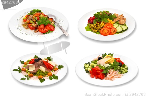 Image of set of salads on white background