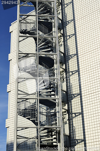 Image of modern fire escape twisted sunlit