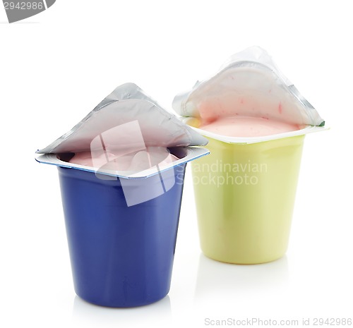 Image of two plastic yogurt pots