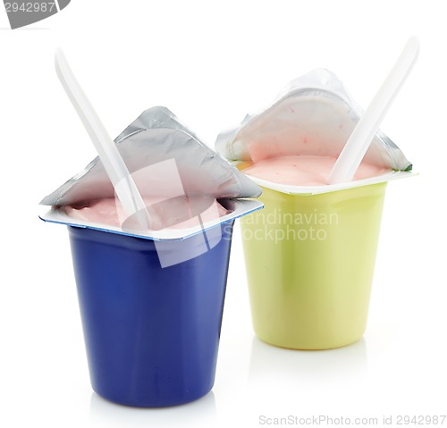 Image of two plastic yogurt pots