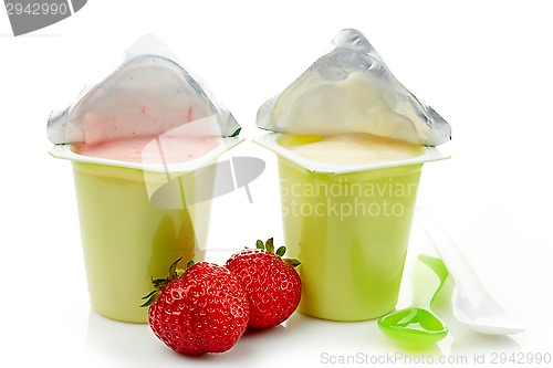 Image of two plastic yogurt pots