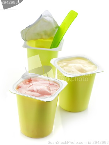 Image of three plastic yogurt pots