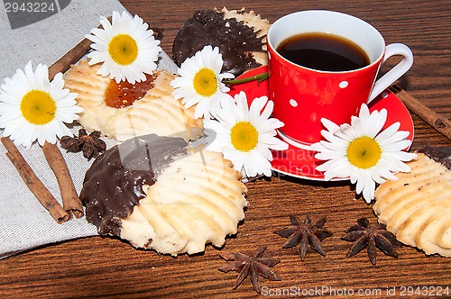 Image of A cup of coffee and shortbread cookies