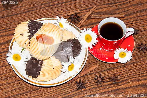 Image of A cup of coffee and shortbread cookies