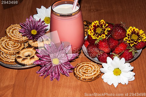 Image of Strawberries milkshake and cookies,