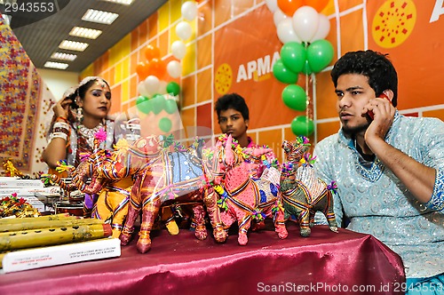 Image of The seller of the colonial goods from India