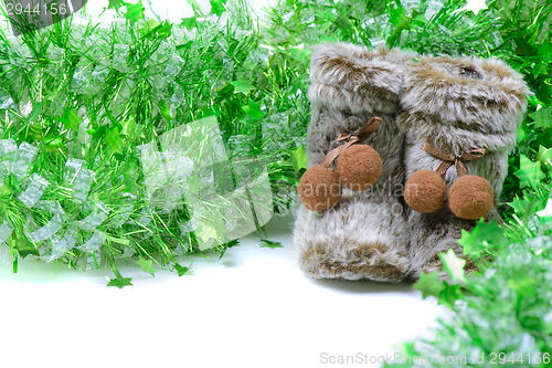 Image of Green tinsel with snow boots decoration