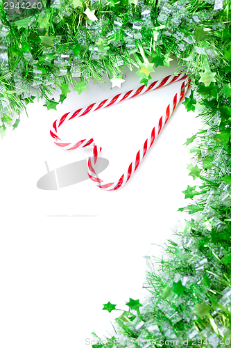 Image of Green tinsel with candy canes decoration