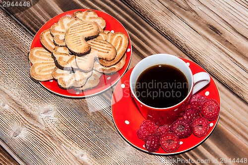 Image of Ripe raspberry and coffee cup 