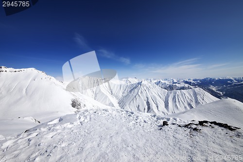 Image of Winter snowy mountains and blue sky