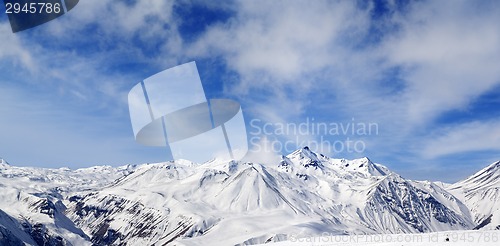 Image of Winter snowy mountains at wind day