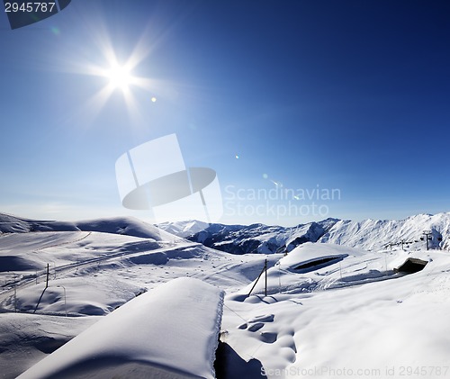 Image of Ski resort and sky with sun