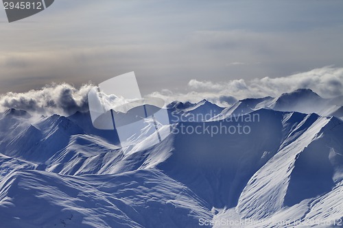 Image of Snowy mountains at winter evening