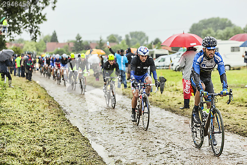 Image of The Cyclist Jose Pimenta Costa Mendes on a Cobbled Road - Tour d