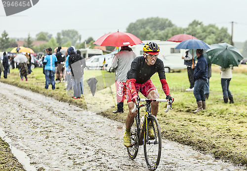 Image of The Cyclist Daniel Navarro Garcia on a Cobbled Road - Tour de Fr