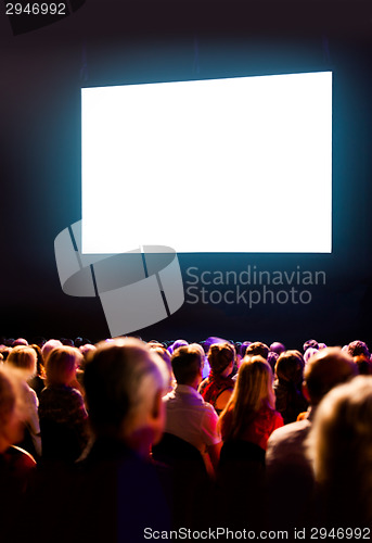 Image of Crowd audience looking at screen