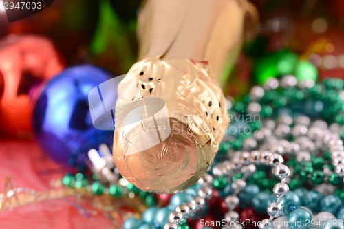 Image of Christmas background with wine bottle and pearls