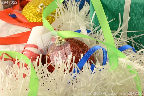 Image of Christmas background with red and blue ribbon and new year balls