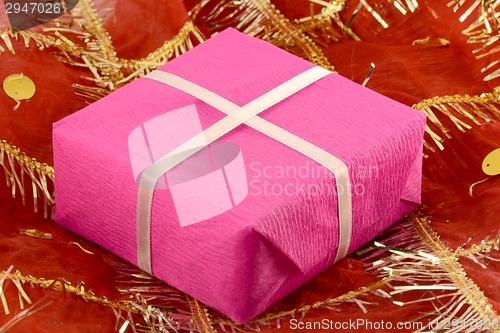 Image of red gift box with white ribbon bow
