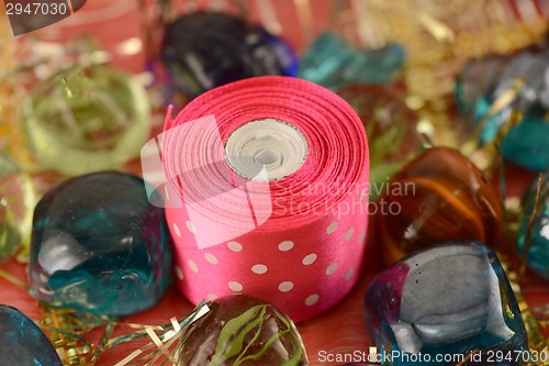 Image of stones and red ribbon, new year invitation card