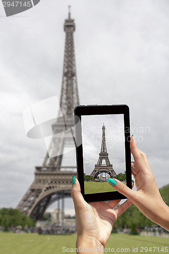 Image of Taken pictures Eiffel Tower with tablet