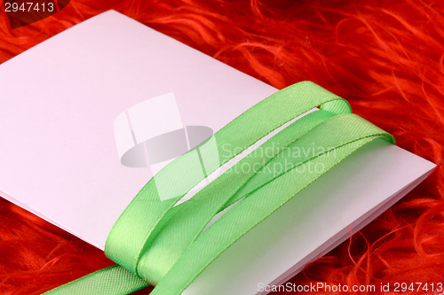 Image of Greeting card with white paper and green bow