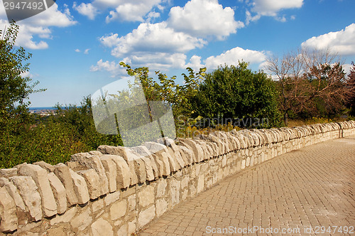 Image of Stone wall sidewalk.