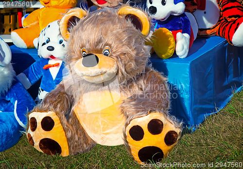 Image of Big toy teddy bear and other children's toys.