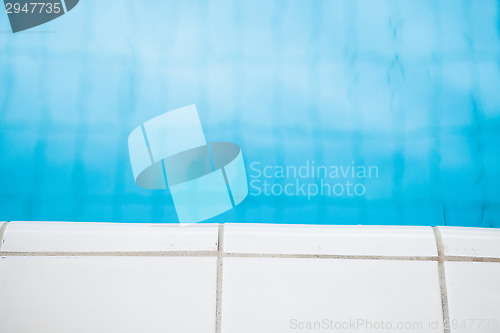 Image of Edge of swimming pool with white tiles