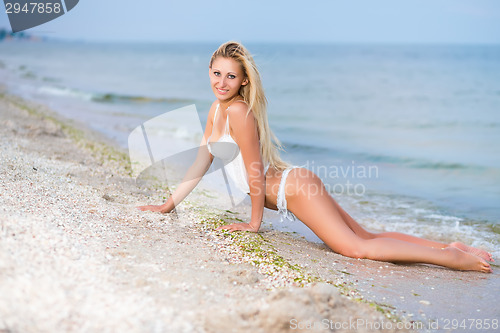 Image of Sexy blond woman in white lingerie