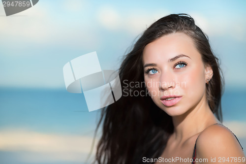 Image of Portrait of thoughtful young brunette