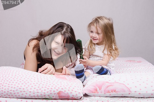 Image of child vomits hair comb mom