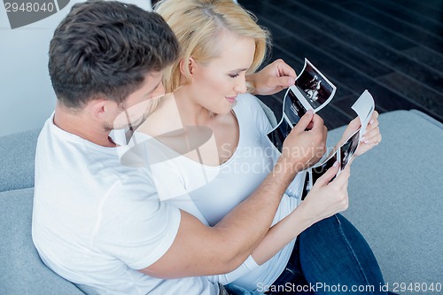 Image of Sweet Couple Looking Ultrasound Result Together