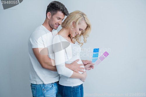 Image of Sweet Middle Age Couple Feels Baby at Womb